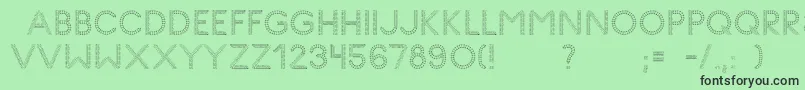 Fonte GlyphStitch – fontes pretas em um fundo verde