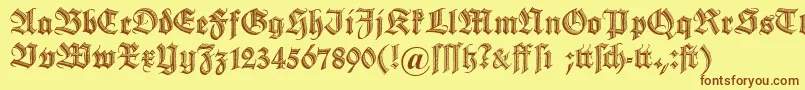 フォントDszierschrift – 茶色の文字が黄色の背景にあります。