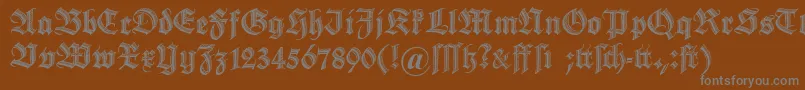 フォントDszierschrift – 茶色の背景に灰色の文字