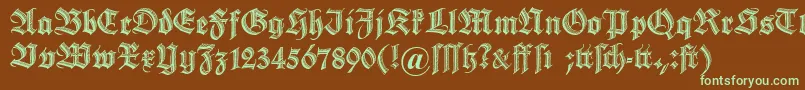 フォントDszierschrift – 緑色の文字が茶色の背景にあります。