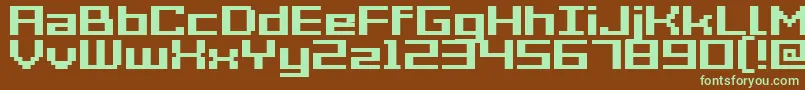 GrixelAcme7WideBold-fontti – vihreät fontit ruskealla taustalla