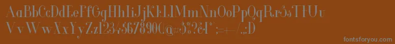 GlamorCondensed-fontti – harmaat kirjasimet ruskealla taustalla