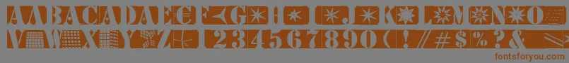 フォントStencilbricksmk – 茶色の文字が灰色の背景にあります。