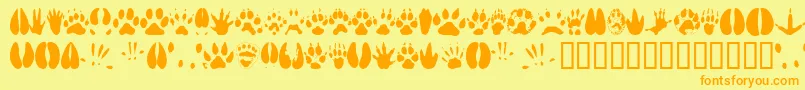 Fonte Animaltracks – fontes laranjas em um fundo amarelo