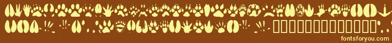 Animaltracks Font – Yellow Fonts on Brown Background