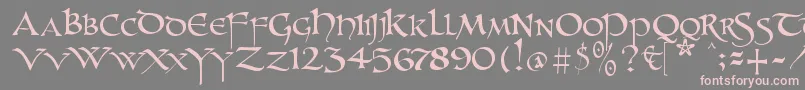 フォントUnzialish – 灰色の背景にピンクのフォント