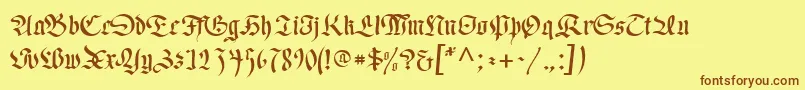 フォントRegentUnz – 茶色の文字が黄色の背景にあります。