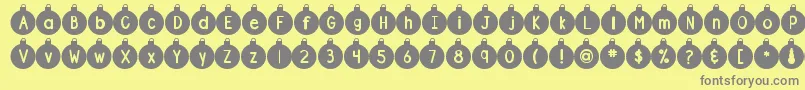 フォントDjbOrnamental – 黄色の背景に灰色の文字