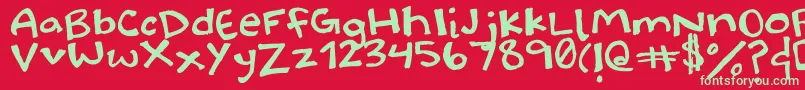 Halidoodle-Schriftart – Grüne Schriften auf rotem Hintergrund