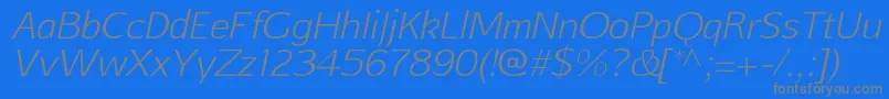 Czcionka AftasansthinItalic – szare czcionki na niebieskim tle