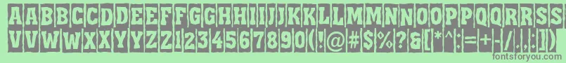 フォントAAssuantitulcmbrk – 緑の背景に灰色の文字