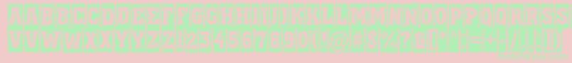 フォントAAssuantitulcmbrk – ピンクの背景に緑の文字
