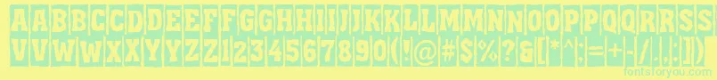 フォントAAssuantitulcmbrk – 黄色い背景に緑の文字