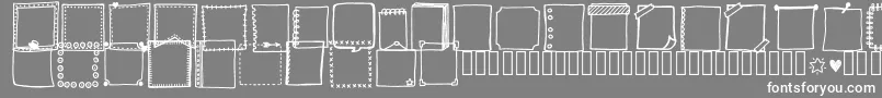 フォントTanaesteldoodleframes01Regular – 灰色の背景に白い文字