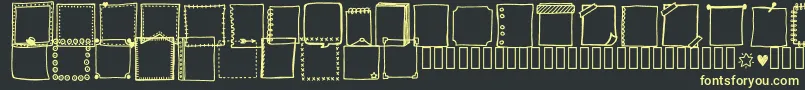 Czcionka Tanaesteldoodleframes01Regular – żółte czcionki na czarnym tle