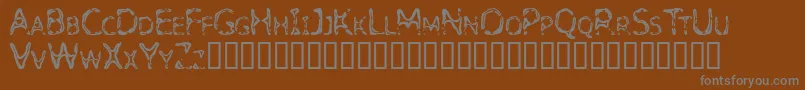 Detoxify-Schriftart – Graue Schriften auf braunem Hintergrund
