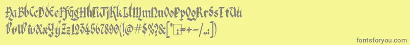 フォントKingthingsItalique – 黄色の背景に灰色の文字