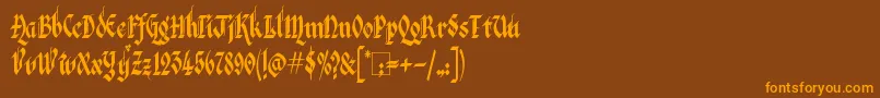 フォントKingthingsItalique – オレンジ色の文字が茶色の背景にあります。