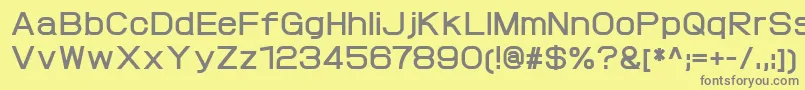 ProtofetBold-fontti – harmaat kirjasimet keltaisella taustalla