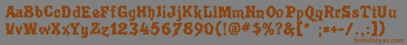 フォントPoultrygeist – 茶色の文字が灰色の背景にあります。