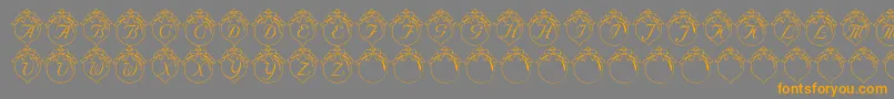 フォントLmsHowLovelyAreThyBranches – オレンジの文字は灰色の背景にあります。