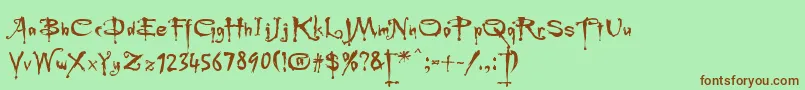Fonte Rebuffed – fontes marrons em um fundo verde