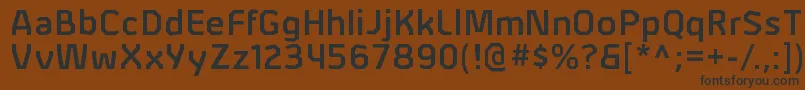 AlphiisbRegular Font – Black Fonts on Brown Background