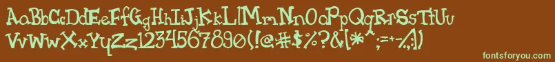 フォントPink – 緑色の文字が茶色の背景にあります。