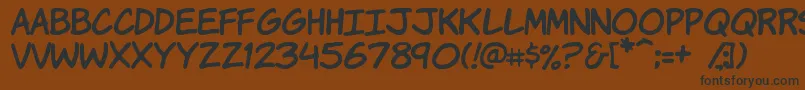 Komikah-fontti – mustat fontit ruskealla taustalla