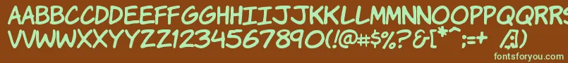フォントKomikah – 緑色の文字が茶色の背景にあります。