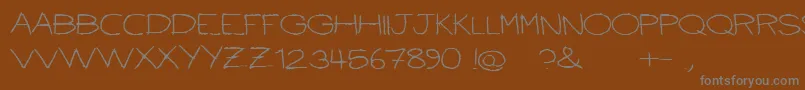 Ballpointscratch Font – Gray Fonts on Brown Background