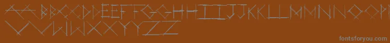 フォントStrokeyBold – 茶色の背景に灰色の文字