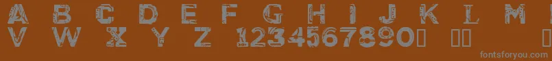 CfcyborgpersonaluseRegular-fontti – harmaat kirjasimet ruskealla taustalla