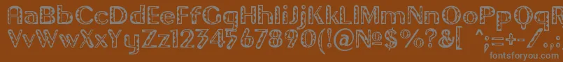 フォントGilgongoTiki – 茶色の背景に灰色の文字