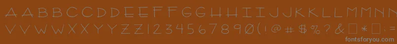 2peasArizona-fontti – harmaat kirjasimet ruskealla taustalla