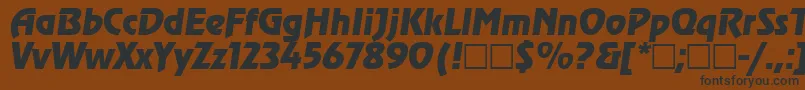 RevueItalic-fontti – mustat fontit ruskealla taustalla