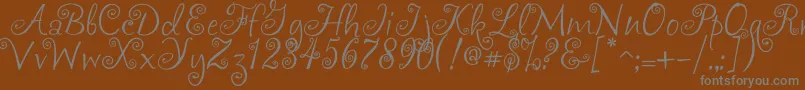 Akafrivolity-Schriftart – Graue Schriften auf braunem Hintergrund