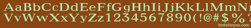 フォントMaximusltstd – 緑色の文字が茶色の背景にあります。