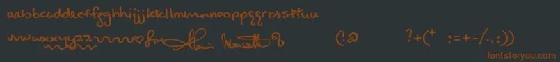 Alanishand Font – Brown Fonts on Black Background