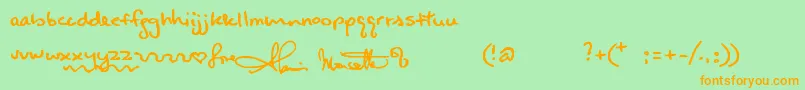 フォントAlanishand – オレンジの文字が緑の背景にあります。
