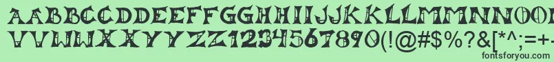 Lestat Font – Black Fonts on Green Background