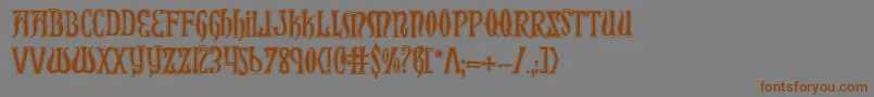 フォントXiphoscol – 茶色の文字が灰色の背景にあります。