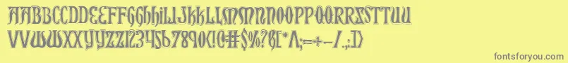 フォントXiphoscol – 黄色の背景に灰色の文字