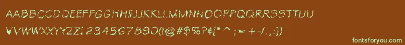 フォントVtcKrinkleKutThin – 緑色の文字が茶色の背景にあります。