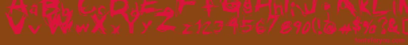 GrungeRegular Font – Red Fonts on Brown Background