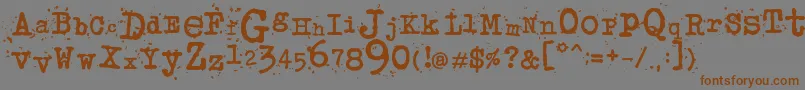 Więcej informacji o czcionce JunkosTypewriter Czcionka JunkosTypewriter – brązowe czcionki na szarym tle