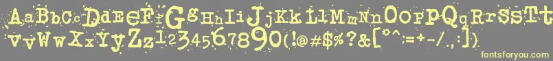More about JunkosTypewriter Font JunkosTypewriter Font – Yellow Fonts on Gray Background