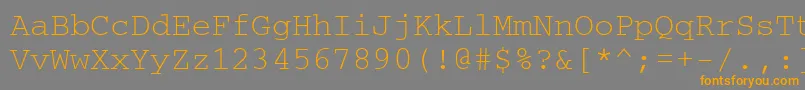 フォントUkrainiancourier – オレンジの文字は灰色の背景にあります。