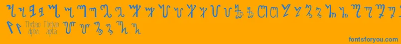 Thebanalphabet-Schriftart – Blaue Schriften auf orangefarbenem Hintergrund