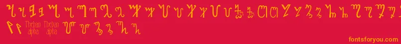 フォントThebanalphabet – 赤い背景にオレンジの文字